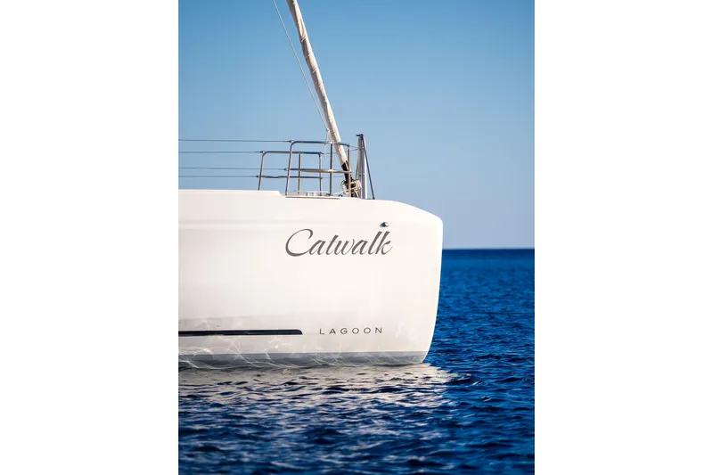 Catwalk Yacht Photos Pics 2023 Lagoon 51 catamaran "Catwalk" on calm blue sea.