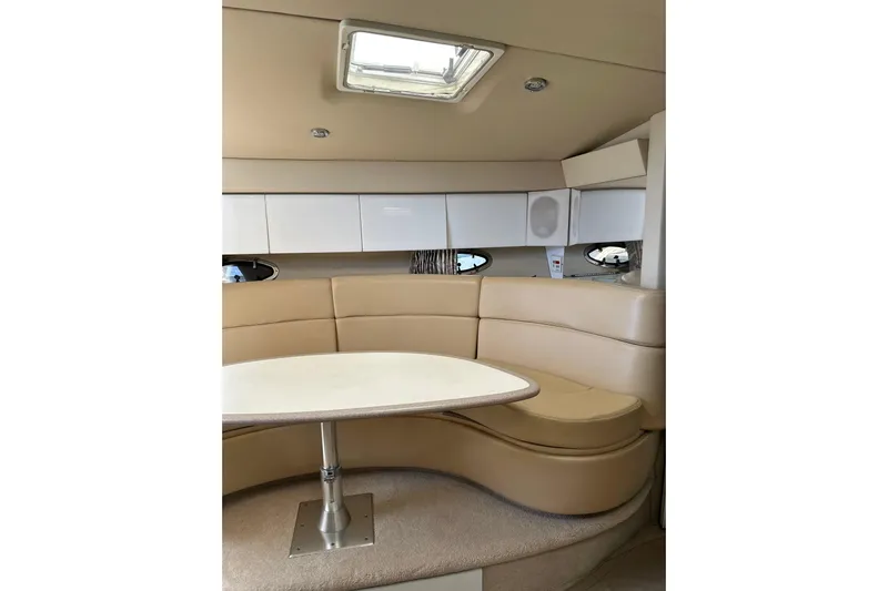  Yacht Photos Pics Interior of 1997 Formula 41 Performance Cruiser with beige seating and white cabinetry.