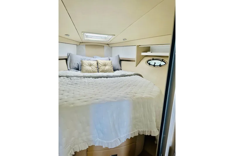  Yacht Photos Pics Cozy bedroom interior of 1997 Formula 41 Performance Cruiser with elegant bedding.