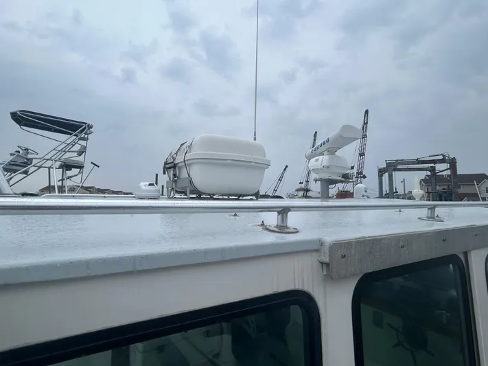 Yacht Photos Pics 1998 Northern Bay Pilothouse 36 boat deck with equipment under cloudy sky.