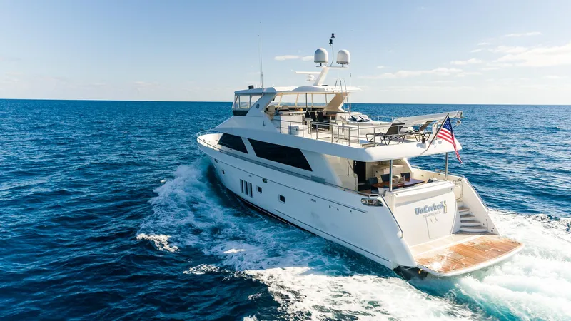 Uncorked Yacht Photos Pics Ocean Alexander 85E yacht cruising on open sea, 2011 model, with American flag.