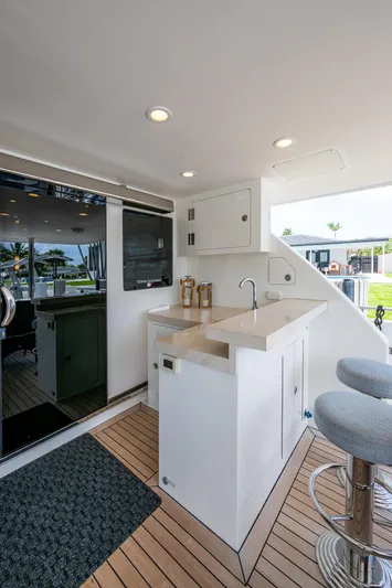 Uncorked Yacht Photos Pics Ocean Alexander 85E 2011 yacht interior with modern bar area and seating.