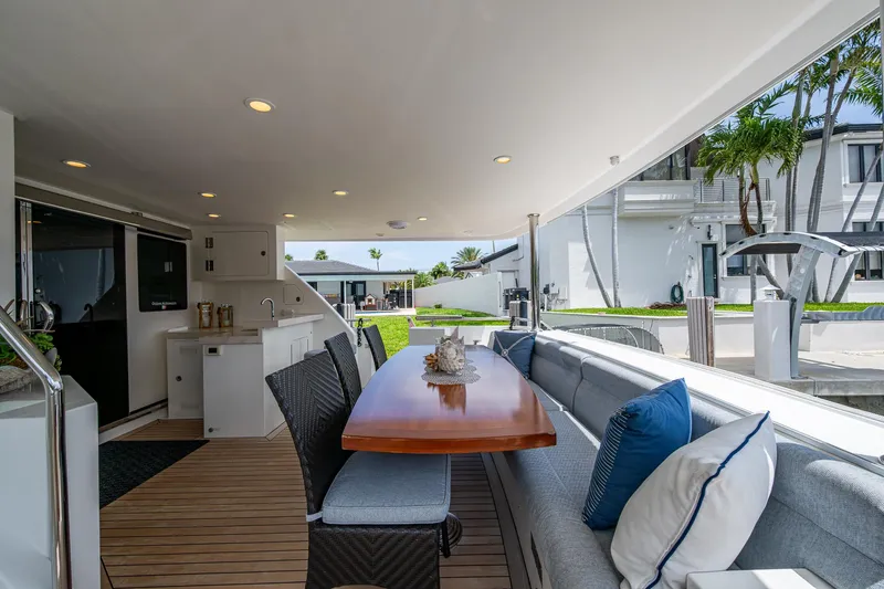 Uncorked Yacht Photos Pics Luxurious outdoor seating on 2011 Ocean Alexander 85E yacht with elegant dining area.