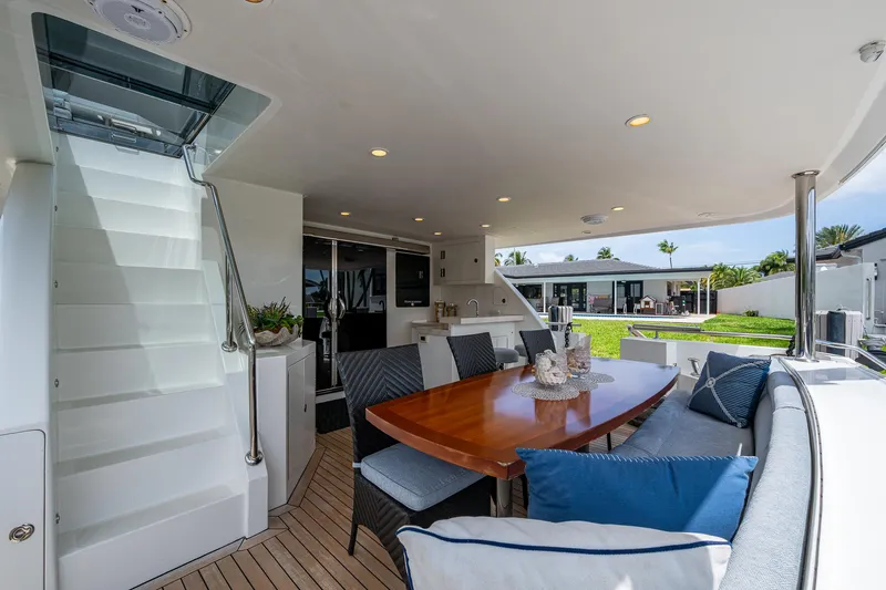 Uncorked Yacht Photos Pics Luxurious Ocean Alexander 85E yacht deck with elegant seating and dining area, 2011 model.