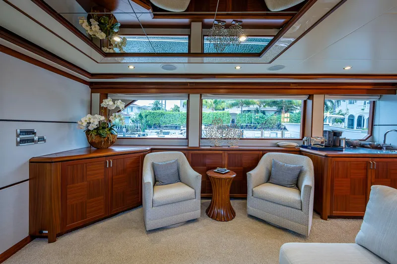 Uncorked Yacht Photos Pics Luxurious interior of 2011 Ocean Alexander 85E yacht with elegant seating and wood accents.