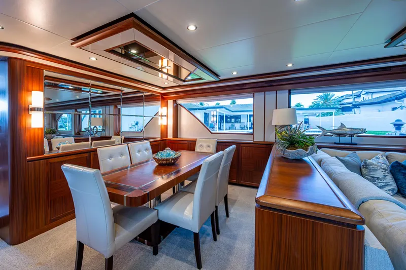 Uncorked Yacht Photos Pics Luxurious interior of 2011 Ocean Alexander 85E yacht with elegant dining area and plush seating.