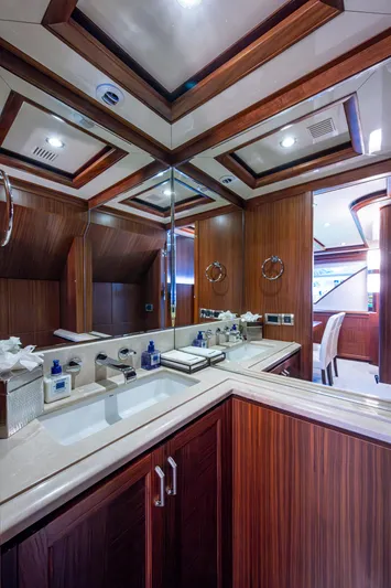 Uncorked Yacht Photos Pics Luxurious bathroom interior of 2011 Ocean Alexander 85E yacht with wood paneling and modern fixtures.