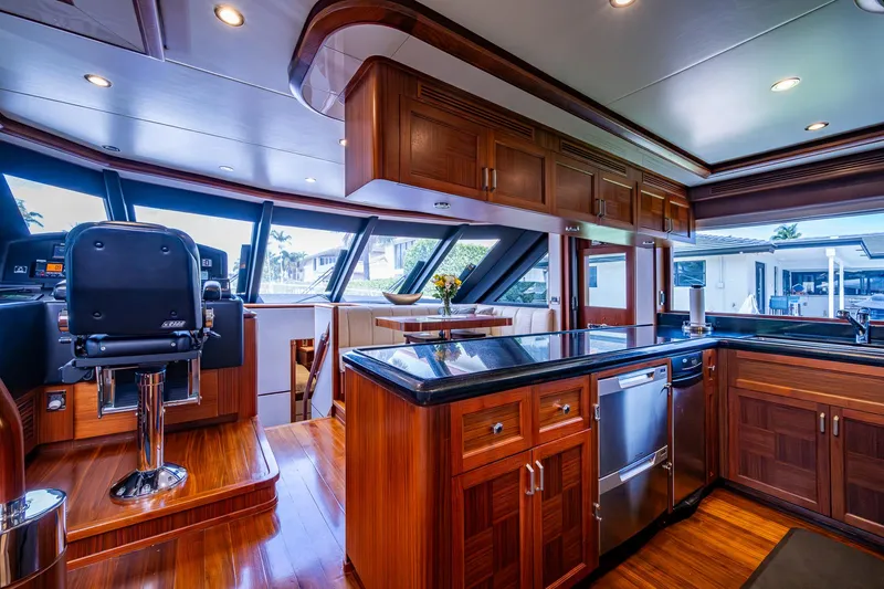 Uncorked Yacht Photos Pics Luxurious interior of 2011 Ocean Alexander 85E yacht with modern kitchen and helm station.