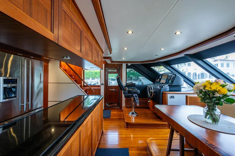 Uncorked Yacht Photos Pics Luxurious interior of 2011 Ocean Alexander 85E yacht with modern kitchen and helm.