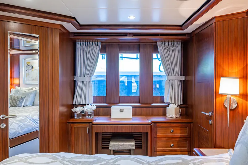 Uncorked Yacht Photos Pics Luxurious cabin interior of 2011 Ocean Alexander 85E yacht with elegant wood finish.