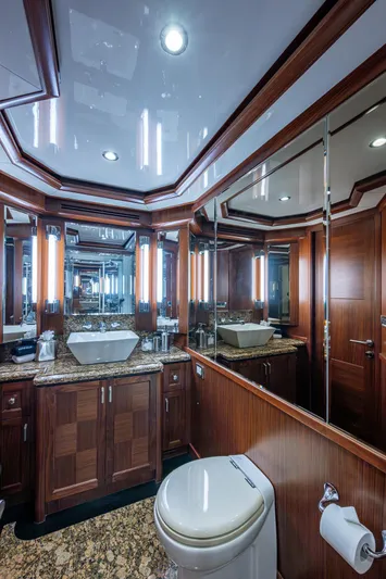 Uncorked Yacht Photos Pics Luxurious bathroom on 2011 Ocean Alexander 85E yacht with elegant wood and marble finishes.