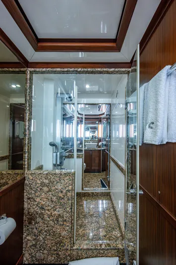 Uncorked Yacht Photos Pics Luxurious bathroom interior of 2011 Ocean Alexander 85E yacht with marble and wood finishes.