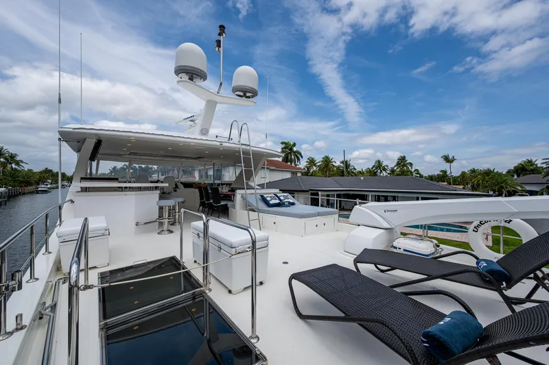 Uncorked Yacht Photos Pics Luxurious 2011 Ocean Alexander 85E yacht deck with lounge chairs and clear skies.