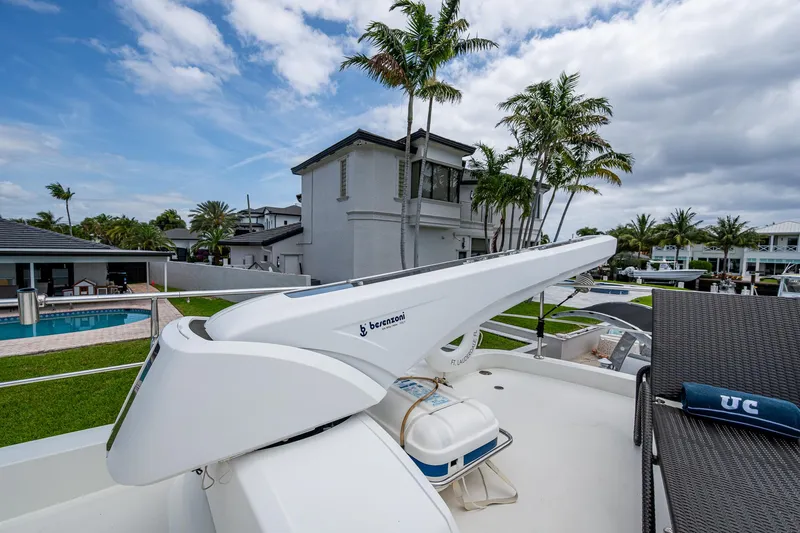 Uncorked Yacht Photos Pics Luxurious 2011 Ocean Alexander 85E yacht with modern amenities, docked near waterfront homes.