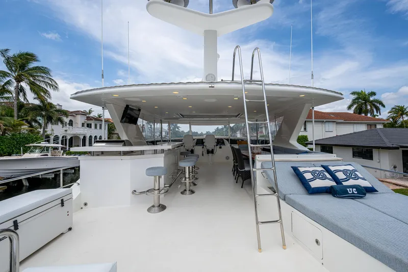 Uncorked Yacht Photos Pics Luxurious 2011 Ocean Alexander 85E yacht deck with seating and bar area.