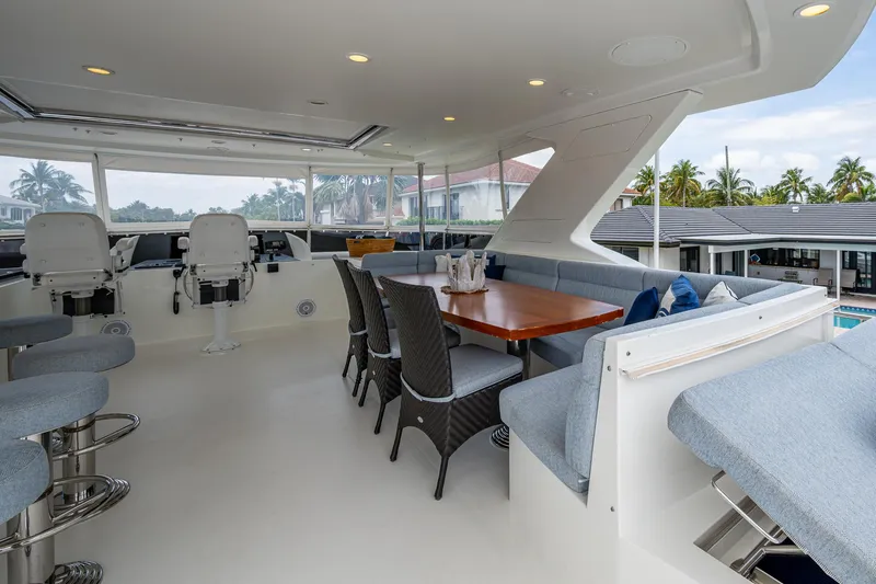 Uncorked Yacht Photos Pics Luxurious 2011 Ocean Alexander 85E yacht interior with seating and dining area.