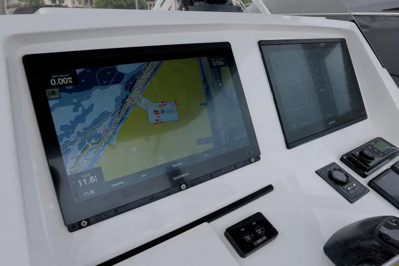  Yacht Photos Pics 2014 Intrepid 327 Cuddy boat dashboard with Garmin navigation screens.