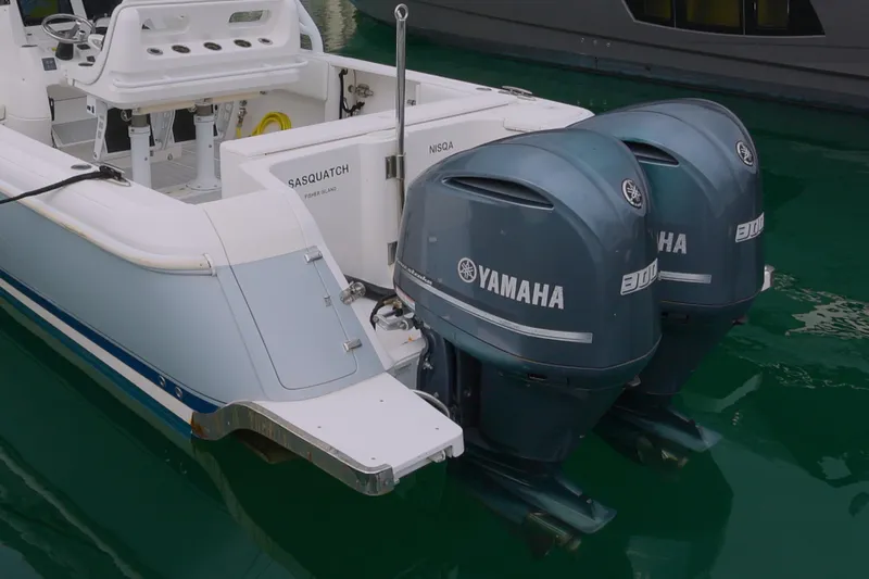  Yacht Photos Pics 2014 Intrepid 327 Cuddy with dual Yamaha engines docked in marina.