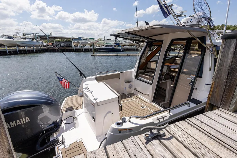  Yacht Photos Pics Manufacturer Provided Image: 2022 Cutwater C-248 Coupe docked, showcasing rear deck and Yamaha outboard motor.