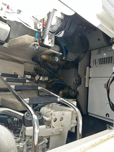 Incentive Yacht Photos Pics Engine room of a 2008 Sea Ray 47 Sedan Bridge with visible machinery and components.