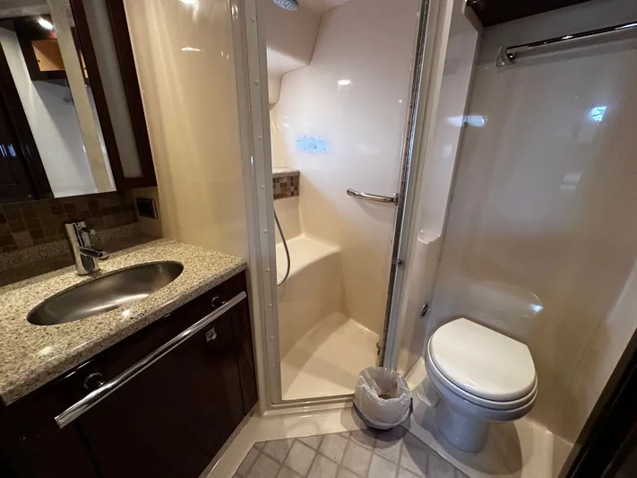 Incentive Yacht Photos Pics Luxurious bathroom in 2008 Sea Ray 47 Sedan Bridge yacht with shower and granite countertop.