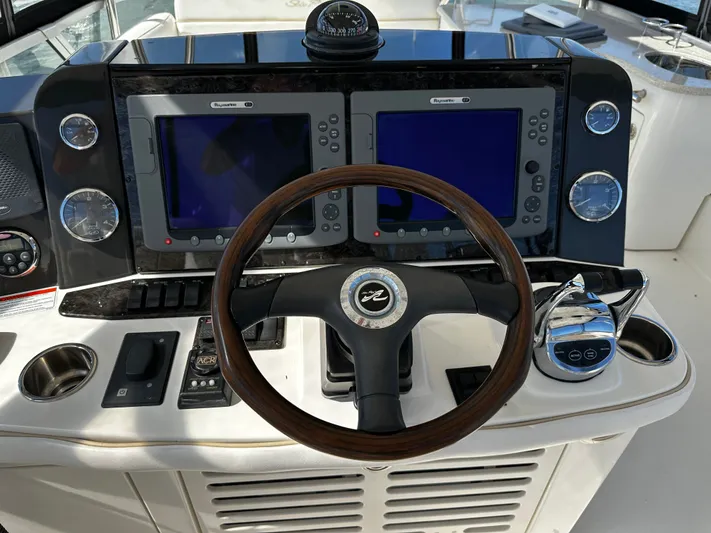 Incentive Yacht Photos Pics 2008 Sea Ray 47 Sedan Bridge helm with dual displays and wooden steering wheel.