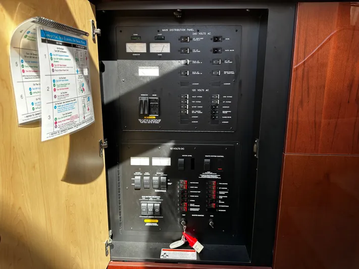 Incentive Yacht Photos Pics Electrical panel inside 2008 Sea Ray 47 Sedan Bridge yacht, featuring various switches and controls.