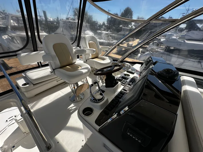 Incentive Yacht Photos Pics 2008 Sea Ray 47 Sedan Bridge helm with dual captain chairs and panoramic windows.