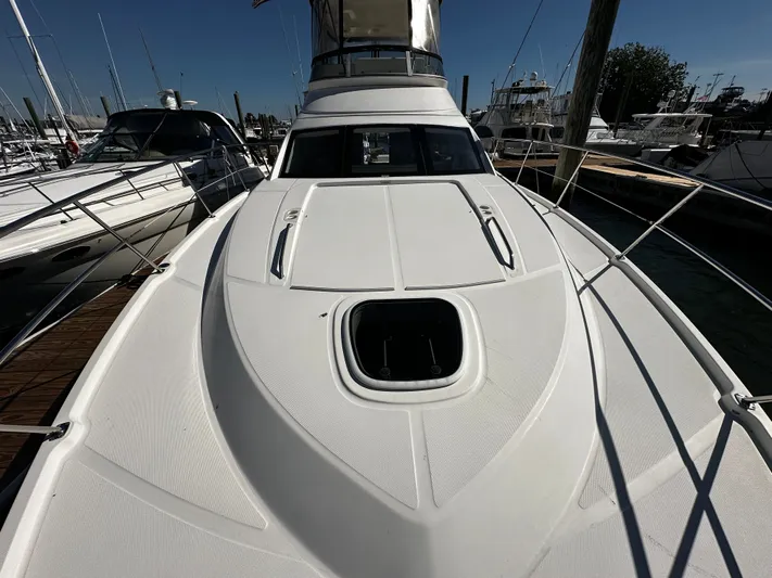 Incentive Yacht Photos Pics 2008 Sea Ray 47 Sedan Bridge yacht docked at marina, showcasing sleek design and spacious deck.