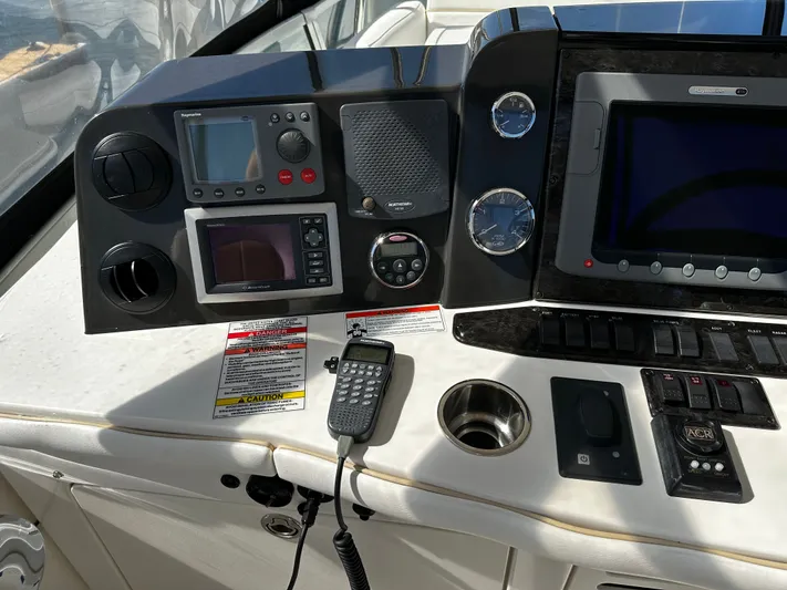 Incentive Yacht Photos Pics Control panel of a 2008 Sea Ray 47 Sedan Bridge yacht with navigation equipment.