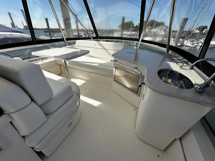 Incentive Yacht Photos Pics Luxurious interior of 2008 Sea Ray 47 Sedan Bridge yacht with seating and kitchenette.