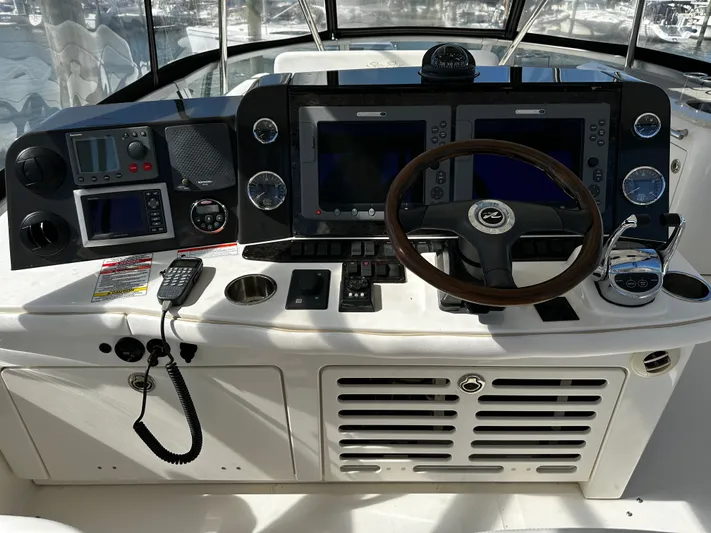 Incentive Yacht Photos Pics 2008 Sea Ray 47 Sedan Bridge helm with navigation controls and steering wheel.