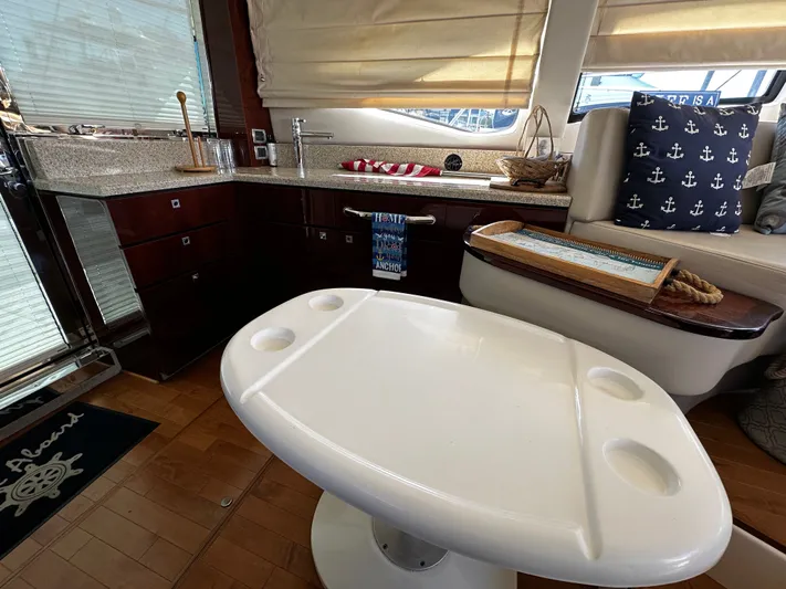 Incentive Yacht Photos Pics Interior of 2008 Sea Ray 47 Sedan Bridge with modern kitchen and nautical decor.