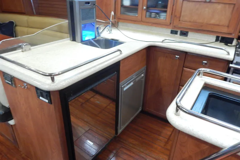  Yacht Photos Pics Modern kitchen area in 2010 Hunter Sailing Diver yacht with wood cabinetry and appliances.