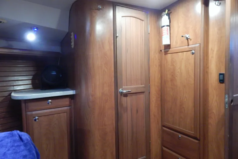  Yacht Photos Pics Interior of 2010 Hunter Sailing Diver with wooden cabinetry and modern lighting.