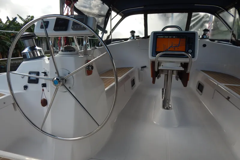  Yacht Photos Pics 2010 Hunter Sailing Diver cockpit with steering wheel and navigation display.