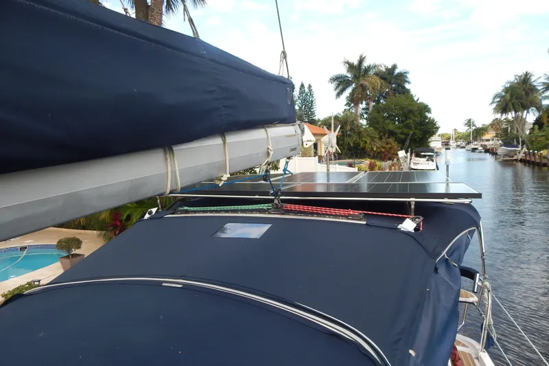  Yacht Photos Pics 2010 Hunter Sailing Diver with solar panels docked by a canal.