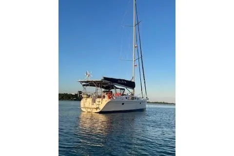  Yacht Photos Pics 2010 Hunter Sailing Diver yacht on calm water at sunset.