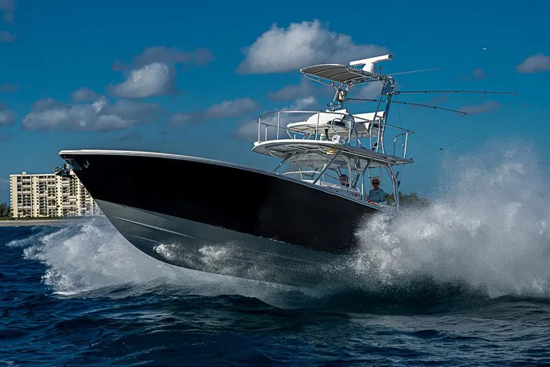  Yacht Photos Pics 2010 Yellowfin 42 Offshore boat navigating through ocean waves.