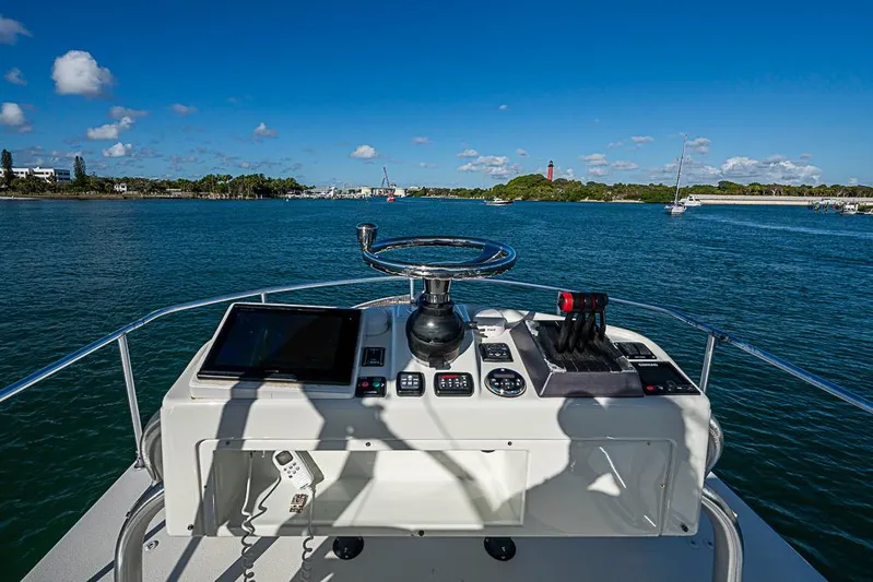  Yacht Photos Pics 2010 Yellowfin 42 Offshore boat helm with ocean view and clear blue sky.