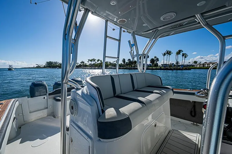  Yacht Photos Pics 2010 Yellowfin 42 Offshore boat interior with seating, ocean view, and sunny sky.