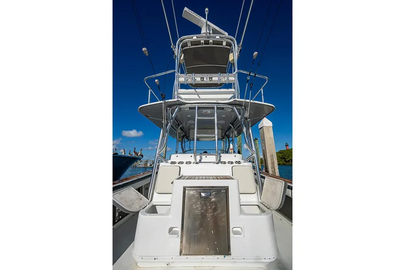  Yacht Photos Pics 2010 Yellowfin 42 Offshore boat with tower against clear blue sky.
