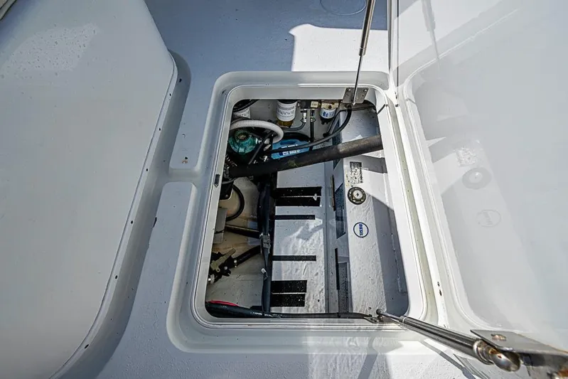  Yacht Photos Pics 2010 Yellowfin 42 Offshore boat compartment with visible mechanical components.
