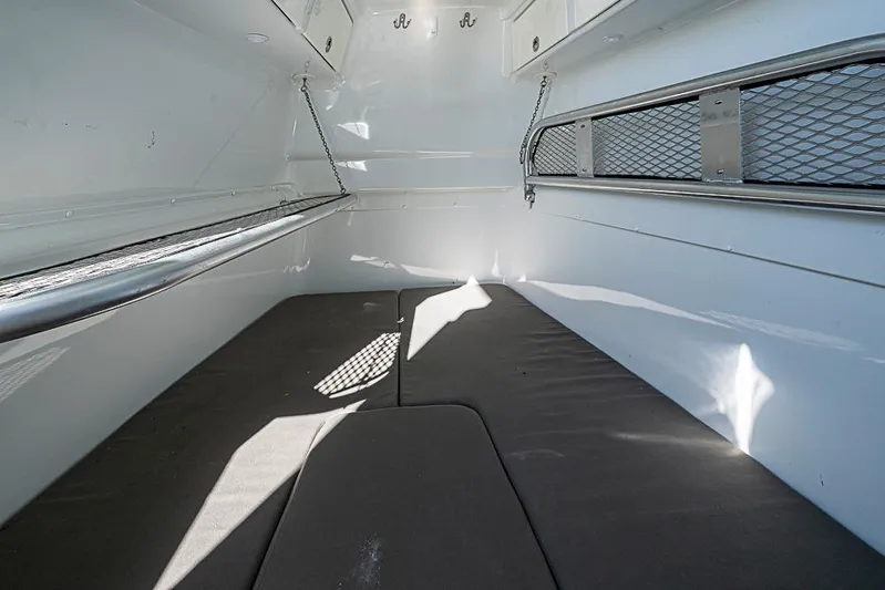  Yacht Photos Pics Interior cabin of 2010 Yellowfin 42 Offshore boat with cushioned seating.