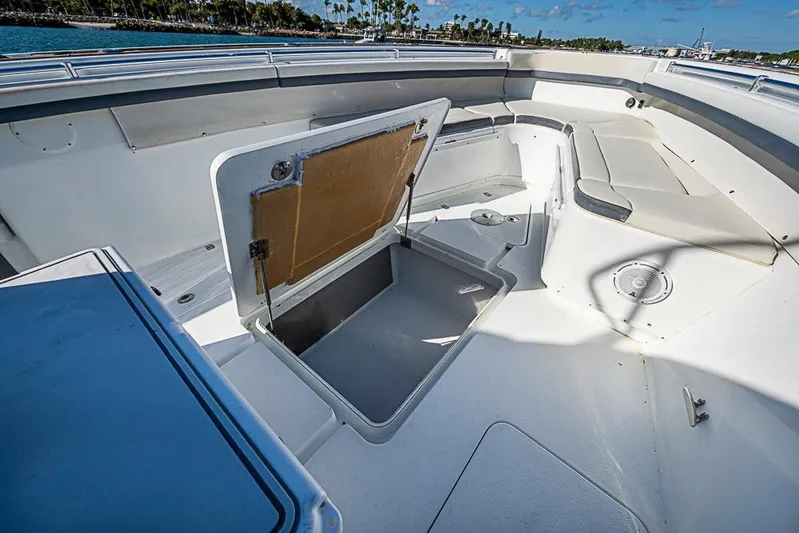  Yacht Photos Pics 2010 Yellowfin 42 Offshore boat interior with open storage compartment and seating area.