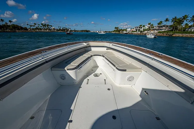  Yacht Photos Pics 2010 Yellowfin 42 Offshore boat with spacious seating, cruising on a sunny day.
