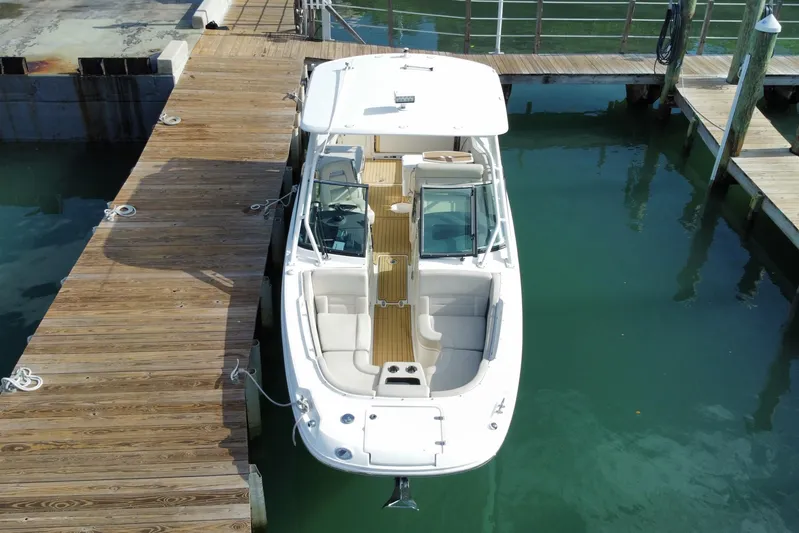  Yacht Photos Pics 2019 Boston Whaler 270 Vantage docked at marina, aerial view.