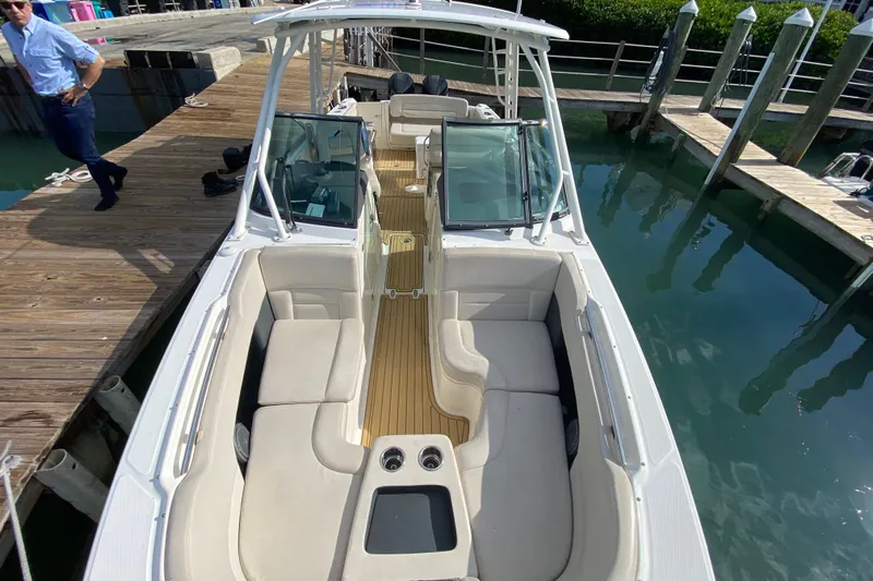  Yacht Photos Pics 2019 Boston Whaler 270 Vantage boat docked, featuring spacious seating and sleek design.