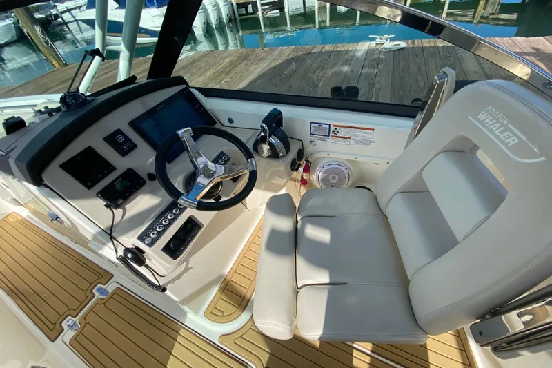  Yacht Photos Pics 2019 Boston Whaler 270 Vantage helm with steering wheel and control panel.