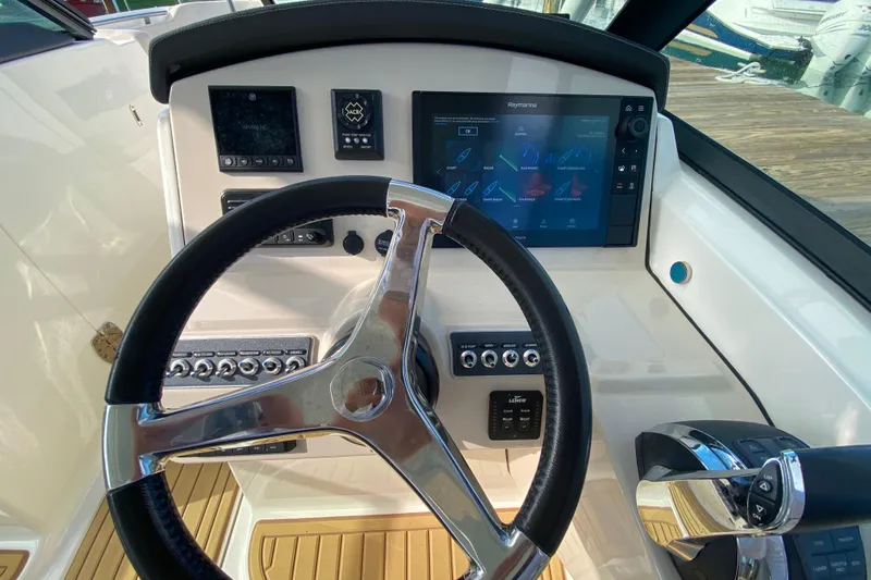  Yacht Photos Pics Steering console of 2019 Boston Whaler 270 Vantage with modern navigation controls.